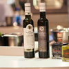 Chef evaluating extra virgin olive oil from a UAE supplier for a restaurant kitchen
