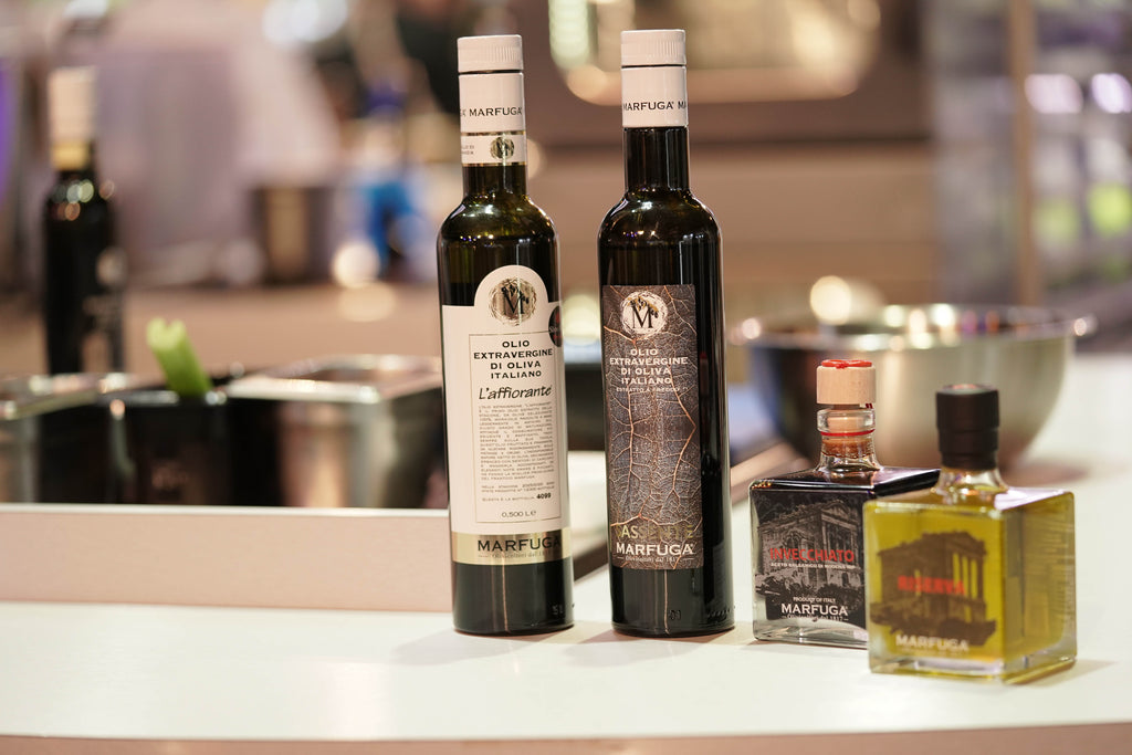 Chef evaluating extra virgin olive oil from a UAE supplier for a restaurant kitchen
